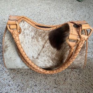 Tooled leather and cow hide purse